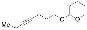 2-(4-Heptyn-1-yloxy)tetrahydro-2H-pyran